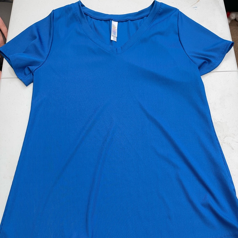 Pretty, silky blue Lularoe Iris top
