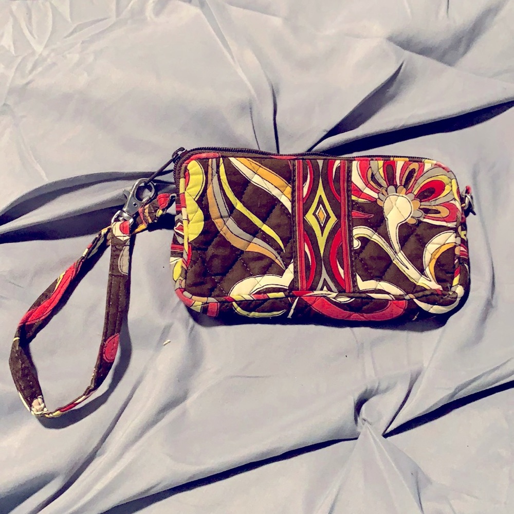 Vera Bradley Wristlet with brown background.