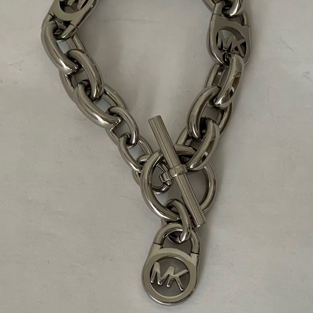 Michael Kors Polished Silver Tone MK Logo-Lock Bracelet. - Picture 2 of 6