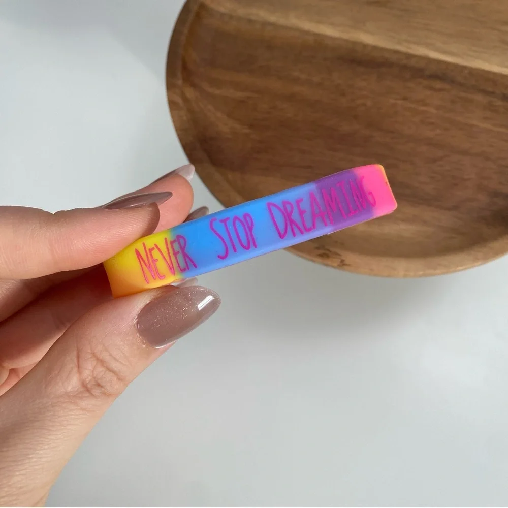 4/$15 Never Stop Dreaming Rainbow Silicone Bracelet - Picture 1 of 3