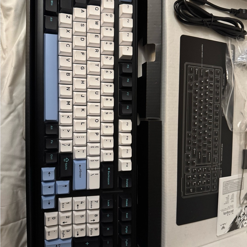 Sleek Black and White Mechanical Keyboard with Blue Accents