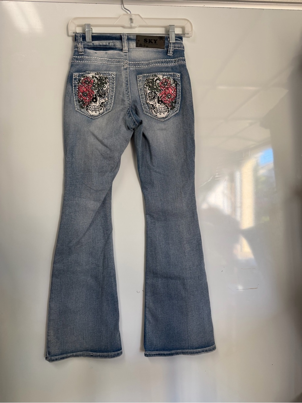Sky Premium Light Blue Flare Skull Floral Rhinestone Jeans with Subtle Fading - Picture 2 of 11